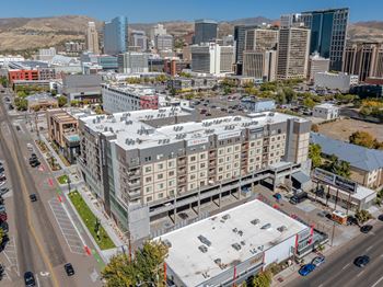 A large building with a parking lot in front of it.